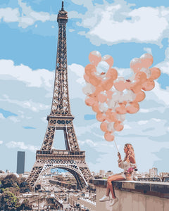 Femme et ballons au bord de la Tour Eiffel